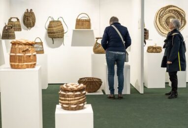 Visitors looking at baskets on display